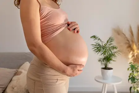 close-up-pregnant-woman-holding-belly