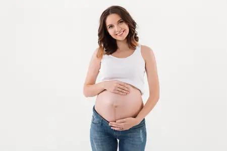 standing-pregnant-woman-showing-her-belly